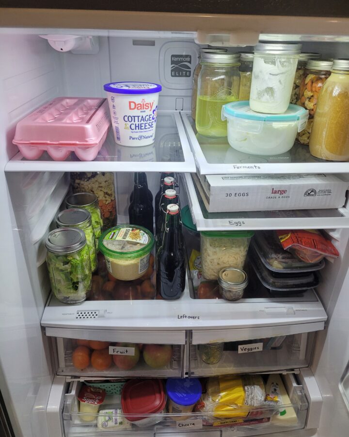 Organized fridge shelves with labels