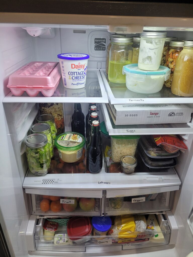 Organized fridge shelves with labels