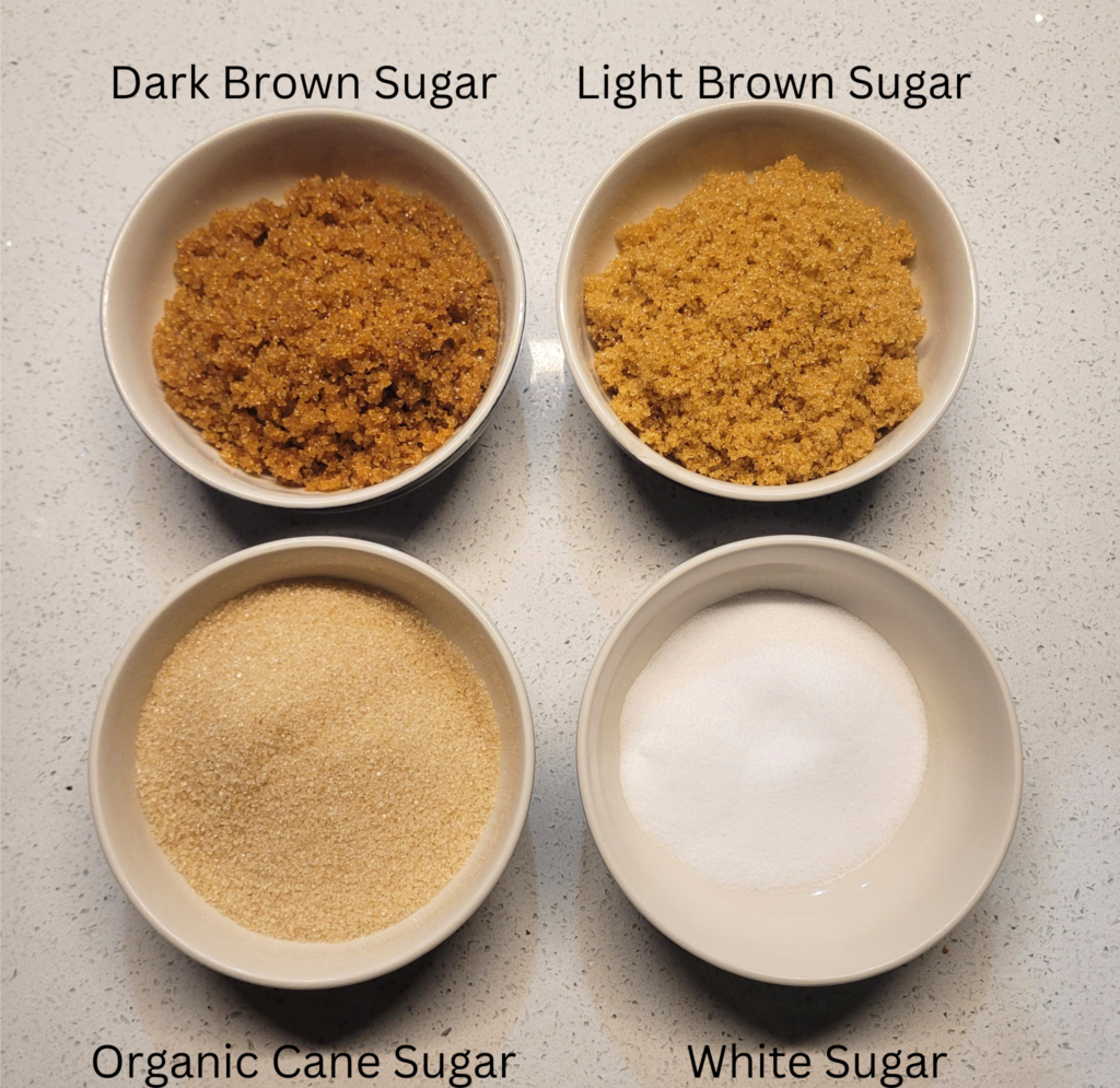 4 bowls of sugar, Dark brown sugar, light brown sugar, organic cane sugar, and white sugar