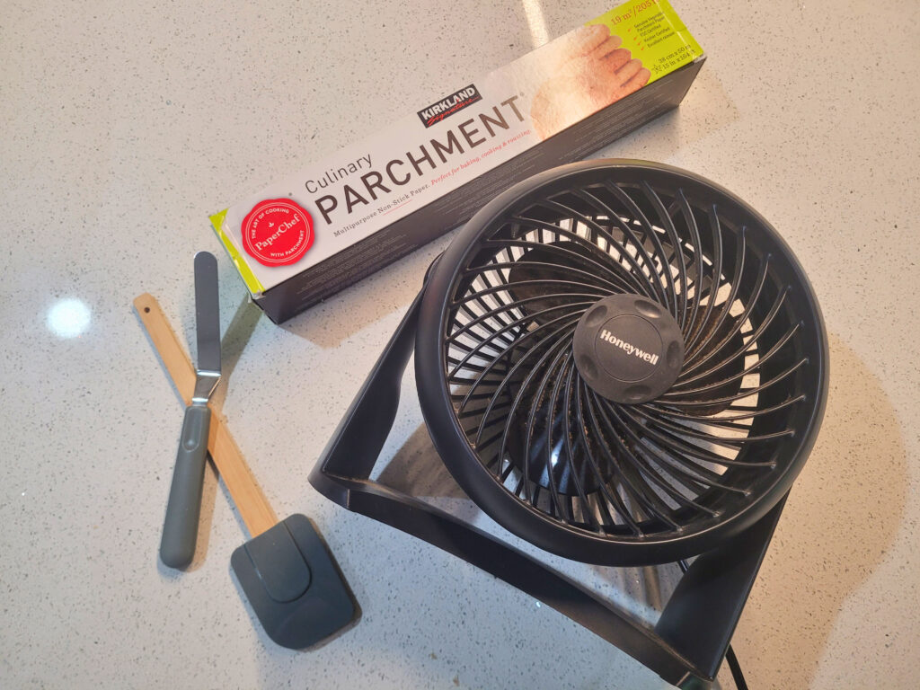 Tools to Dehydrate Sourdough Starter fan, spatula, offset spatula, parchment paper