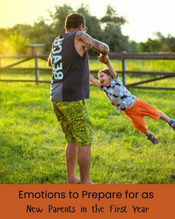dad swinging child in a grassy field