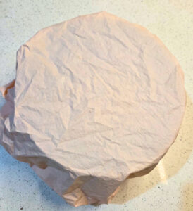 bowl of bread covered