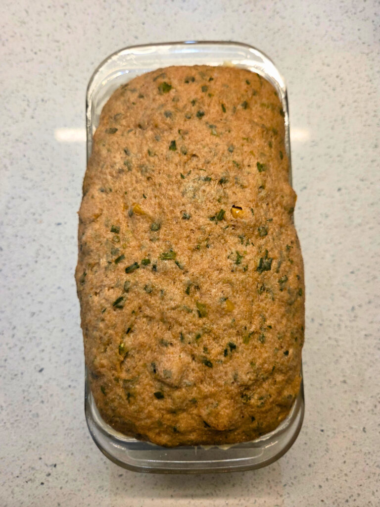 Dough Risen and ready for the Oven - Sourdough Cheddar and Chive Bread.jpg sourdough cheddar and chive bread dough inside a loaf pan