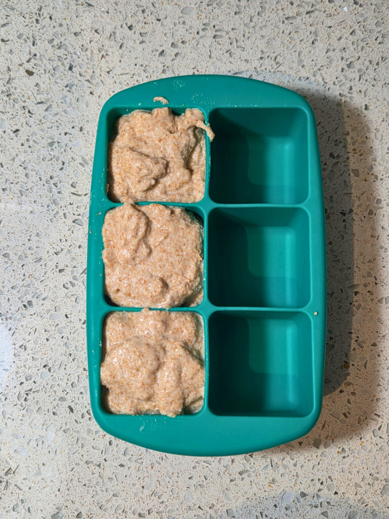 an ice cube tray full of sourdough starter